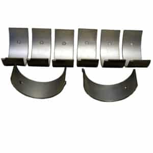 Metallic components, possibly parts of a Racetorations All Steel Rotating Assembly Inc. 89mm Forged Piston & Ring Set, TR2-4A & Morgan +4, are arranged on a white surface. They feature various shapes including hooks and curved plates, consistent with machinery or device elements.
