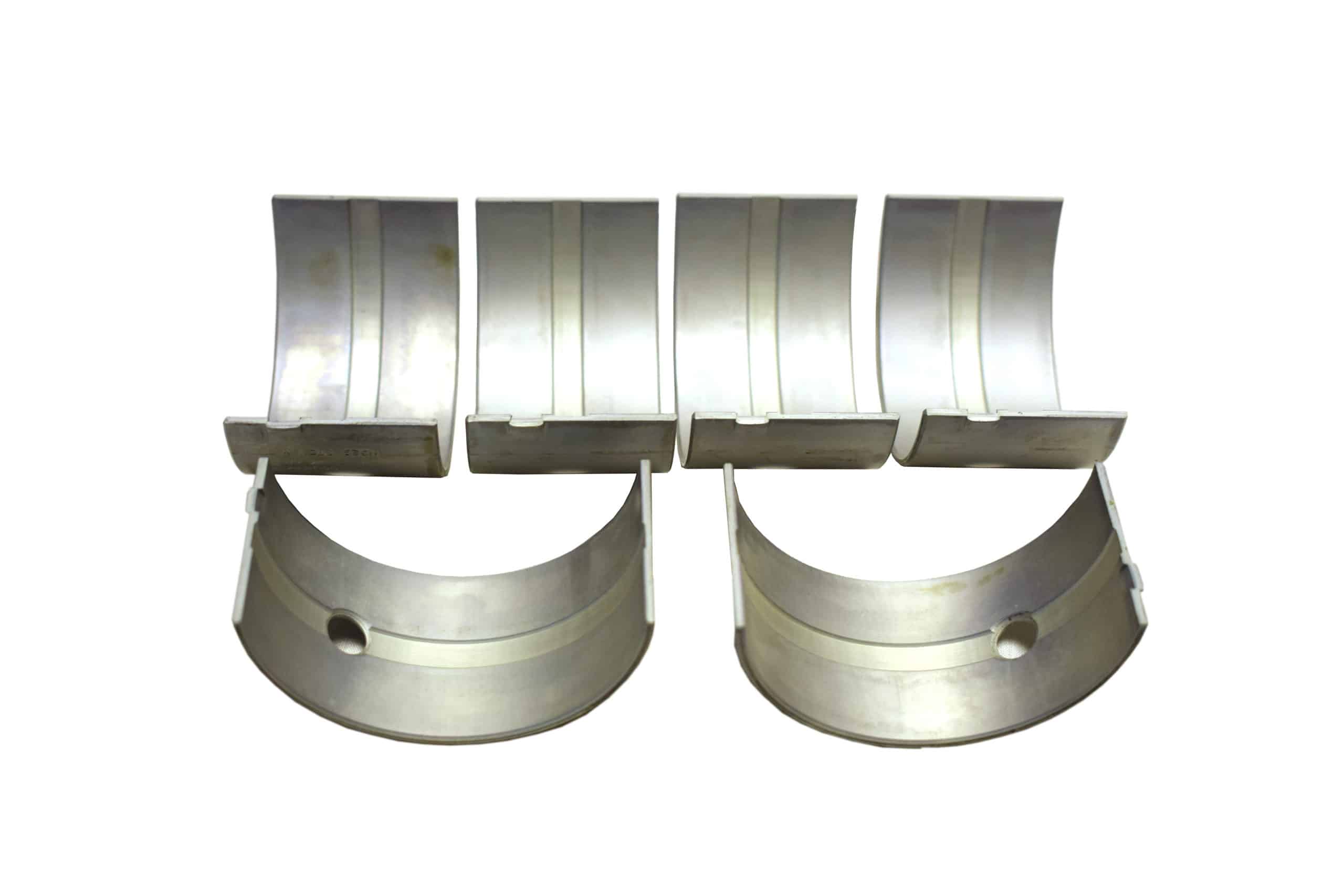 Six semi-circular, shiny Racetorations All Steel Rotating Assembly Inc. 89mm Forged Piston & Ring Set bearings displayed on a white background.