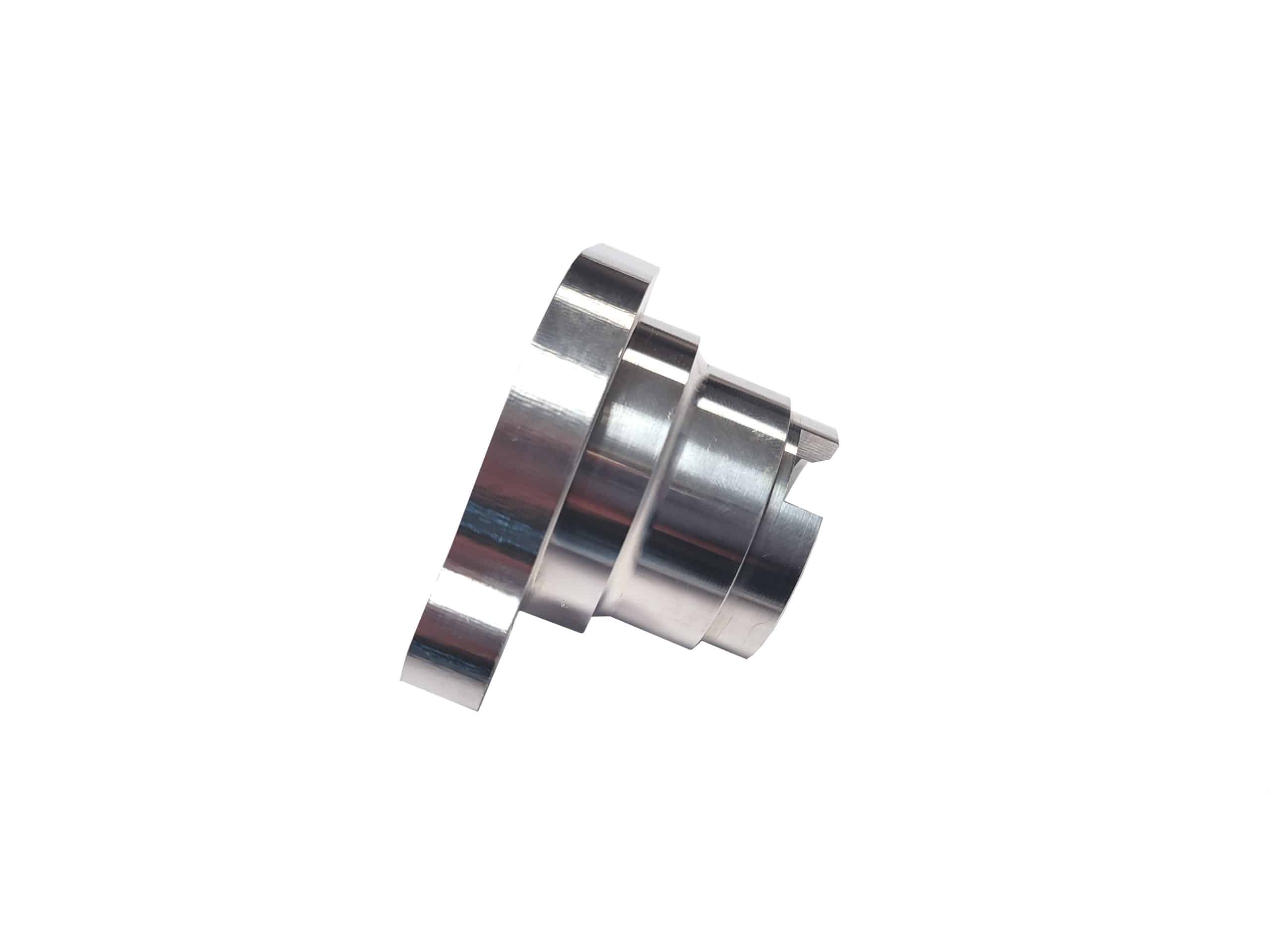 A Racetorations Aluminium Distributor Blank for Electronic Injection Engines, featuring cylindrical sections and a combination of shiny and matte finishes, designed for PI Cars - TR5-6, isolated against a white background.