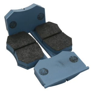 Four TR3-6 brake pads with blue backing and embedded circular metal plates, displayed against a white background, form a Competition Brake Pad Set.