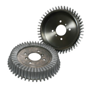 Two metal gears, one new and one used, isolated on a white background. The upper gear is clean with a glossy finish, while the lower one shows signs of wear from Racetorations 9" Rear Brake Drums With Alloy Cooling Fins.