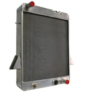 A new car radiator with metal fins and pipes, featuring red-capped inlets or outlets on a white background.