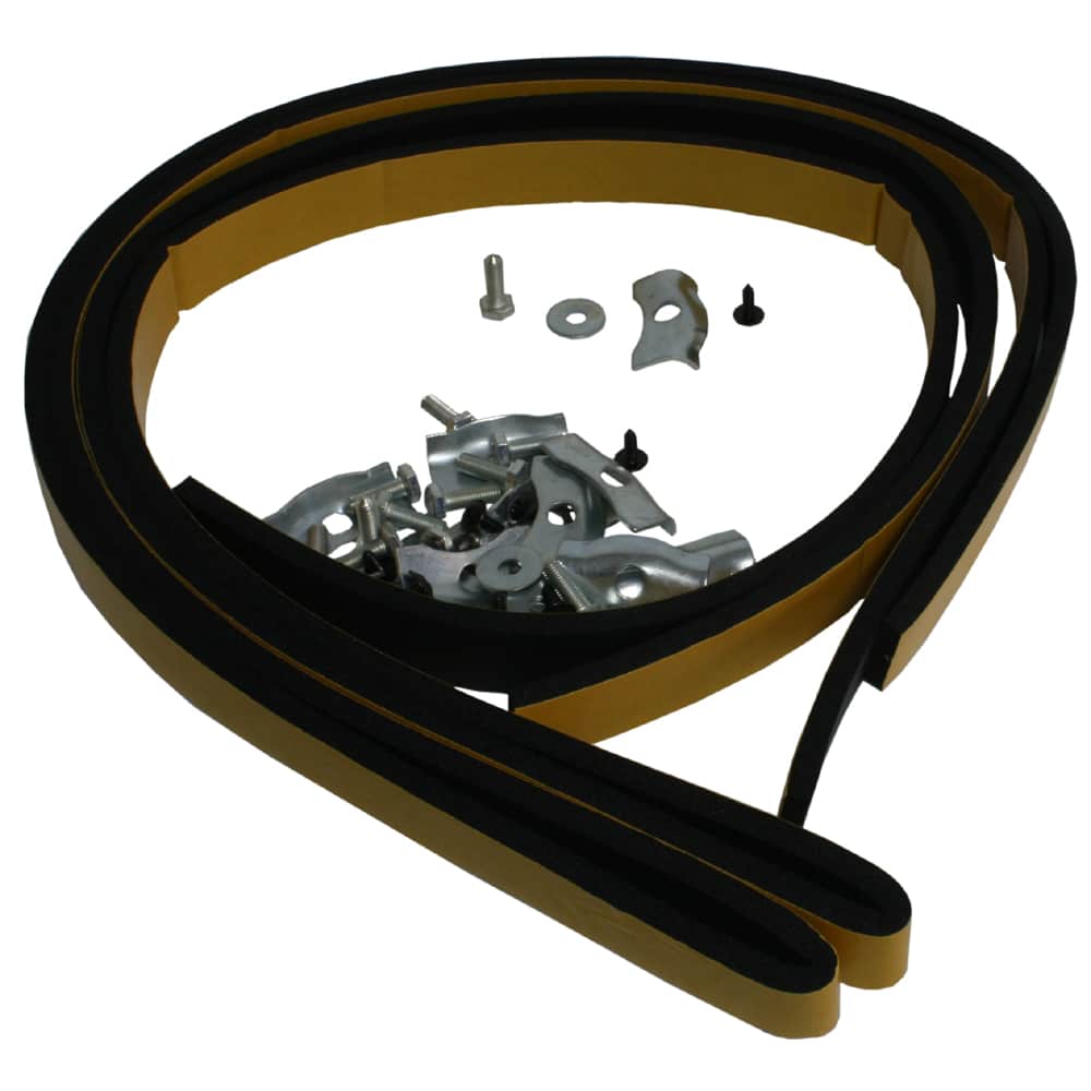 A circular saw blade with various metal parts and a Racetorations Gearbox Tunnel Fitting Kit - TR2-6 loosely arranged within its center, isolated on a white background.