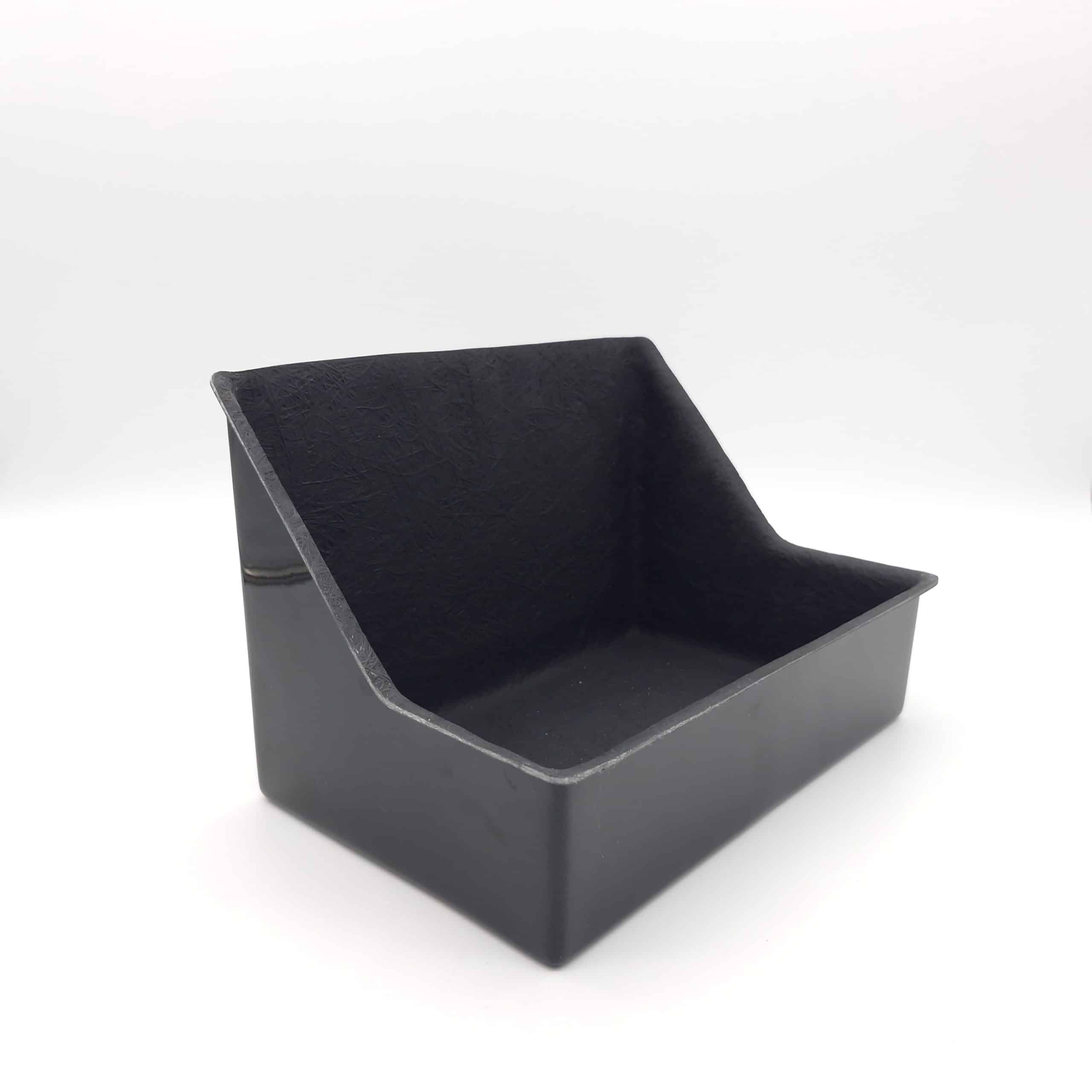 A black, rectangular plastic bin with angled sides and an open top, photographed on a white background—perfect as the Racetorations Fibreglass Battery Tray for TR4-6 models.