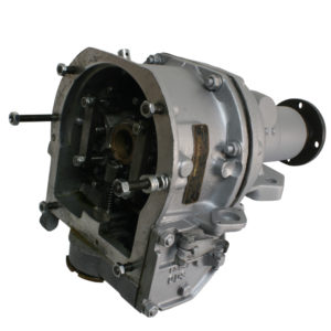 An isolated view of a complex industrial gearbox with exposed internal gears and multiple levers, presented against a white background.