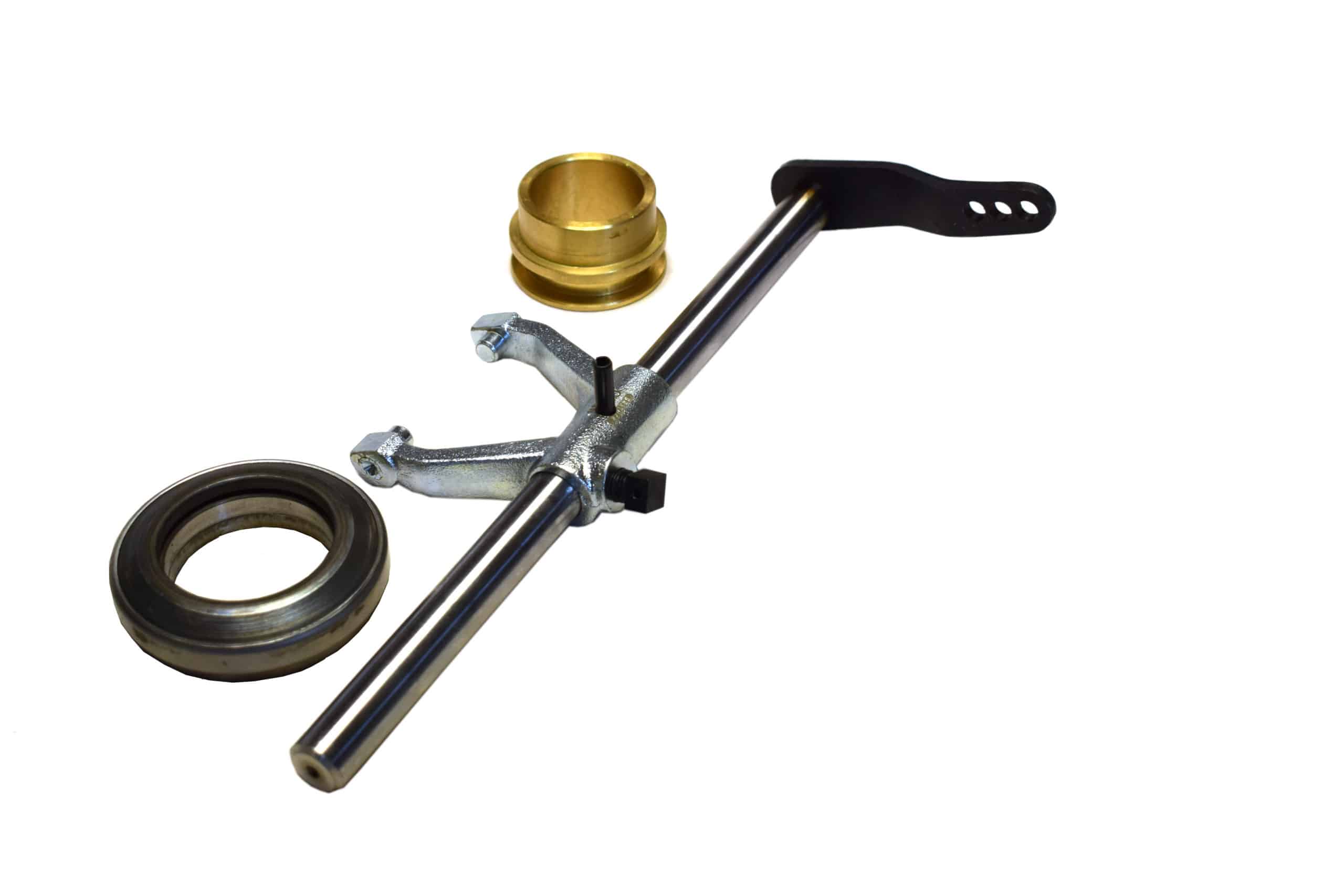 A Racetorations Uprated Gearbox Clutch Release Kit, Mechanical - TR2-6, featuring a clutch hub puller tool with a metal handle and adjustable jaws, accompanied by a small gold-toned component and a circular metallic seal, isolated