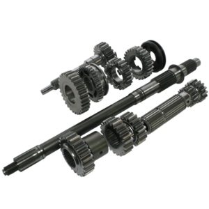 Two metal transmission shafts with multiple gears and splines, plus loose gears and rings, are displayed on a white background. These clean parts are likely components for the Racetorations Quaife Competition "Dog" Gearbox - TR2-6.