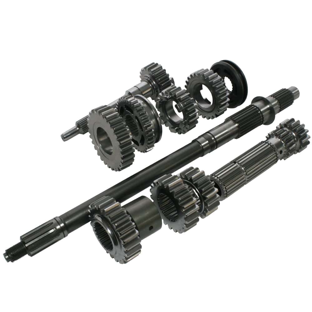 Two metal transmission shafts with multiple gears and splines, plus loose gears and rings, are displayed on a white background. These clean parts are likely components for the Racetorations Quaife Competition "Dog" Gearbox - TR2-6.
