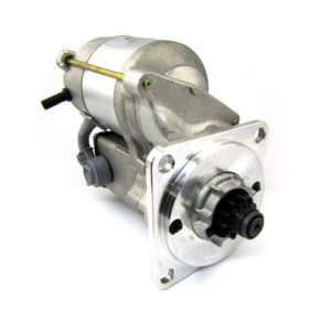PowerLite High Torque Starter Motor - Caterham - K series engine (Caterham bellhousing & sump) isolated on a white background, showing its metallic body and gear shaft.