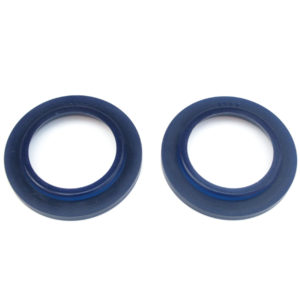 Two blue SuperPro Polyurethane Rear Spring Spacer, Pair - TR4A-6 seals isolated on a white background.