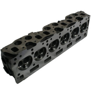 An image of a Racetorations Race Cylinder Head - TR5-6 with multiple valve openings visible, isolated on a white background.