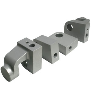 Three metallic hydraulic adapters with l-shaped, block, and t-shaped designs, featuring mounting holes and crafted from the TR2-4A & Morgan +4, isolated on a white background.