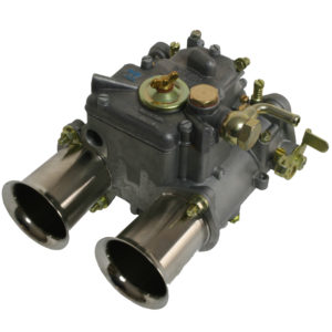 A close-up image of a Weber Twin Choke Carburettor - DCOE40, showing detailed metal parts including intake pipes, adjustment screws, and various connections.