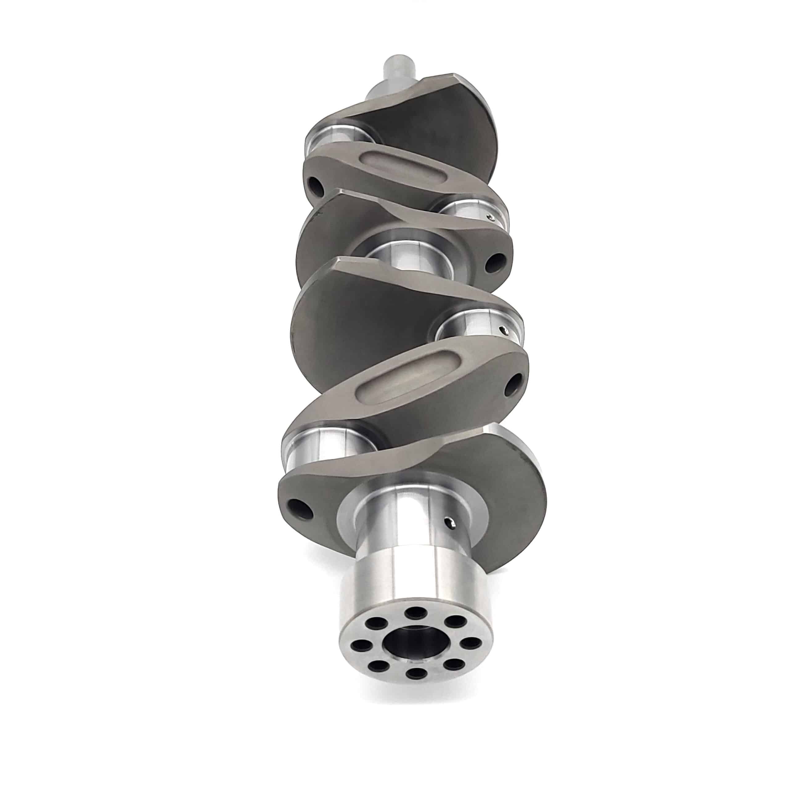 A close-up of the Arrow Precision Engineering Billet Steel Crankshaft, Standard Journal – TR2-4, Morgan +4, highlighting its smooth machined surfaces and rounded counterweights on a white background.