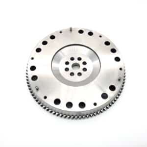 The Racetorations Lightweight One-Piece Flywheel for TR2-4A & Morgan +4 (steel crankshaft, 8½" clutch) is metallic and circular with central holes and outer gear teeth, shown on a white background.