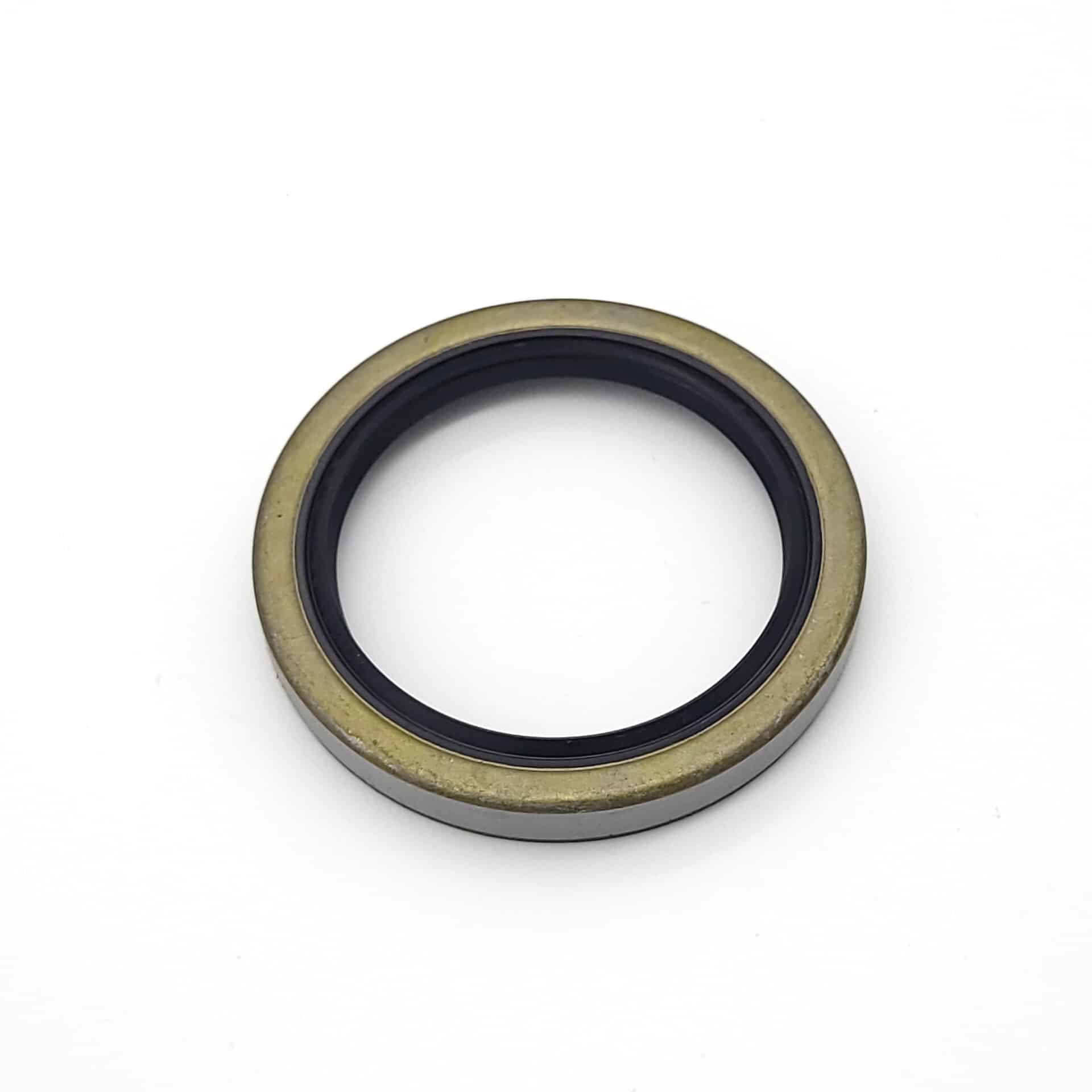 The Rear Hub Seal - TR3-4 is a circular metal seal with a black inner ring and gold outer ring, displayed on a plain white background.