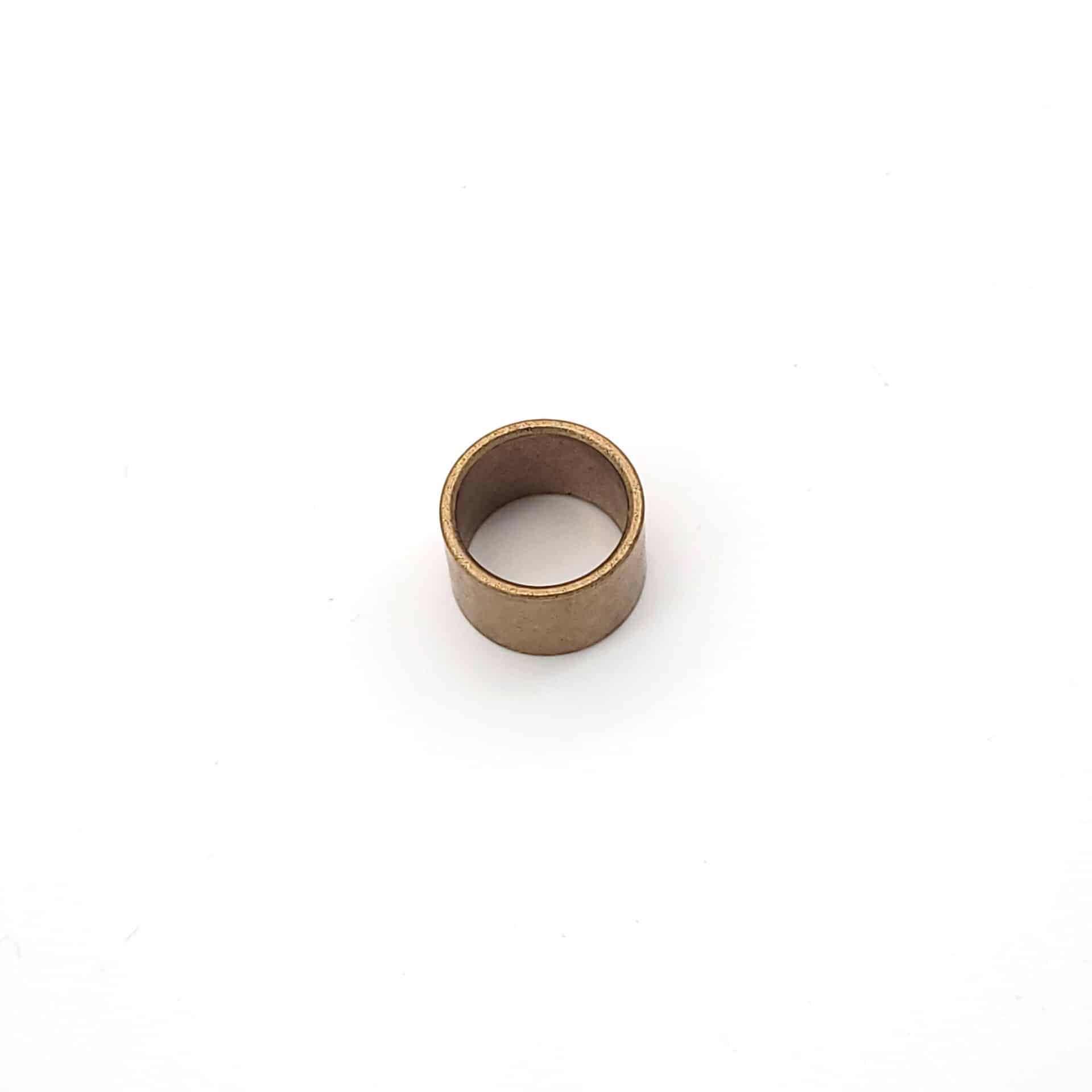A compact, cylindrical Brake & Clutch Pedal Bush - TR2-4A with a hollow centre is displayed on a plain white background.