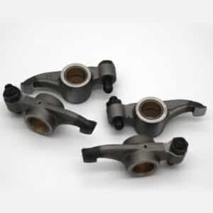 Four TR2-4A Rocker Arm RH, Set components with bushes and bolts are arranged on a white background. The set appears clean and unused, likely intended for automotive engine assembly.
