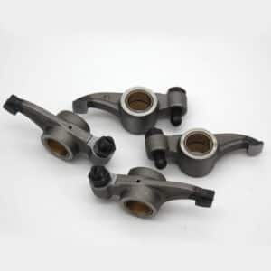 The TR2-4A Rocker Arm RH, Set includes four metal rocker arms with bushes and bolts, arranged on a plain white background. This set provides key components used in internal combustion engines for efficient valve operation.