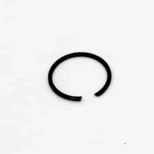 A black metal circlip with a small gap, lying flat on a plain white background.