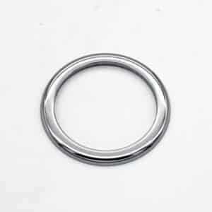 A shiny, metallic silver ring lies flat on a plain white surface.