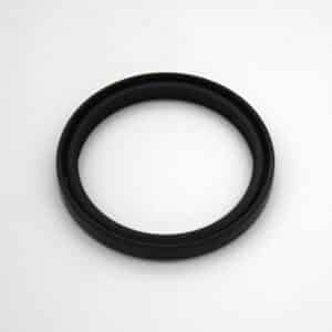 A black circular rubber or plastic ring, likely a gasket or seal, is placed on a plain white background.