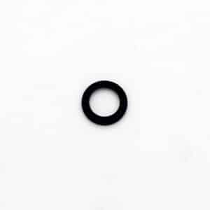 A small black rubber washer or O-ring lies centred on a plain white background.