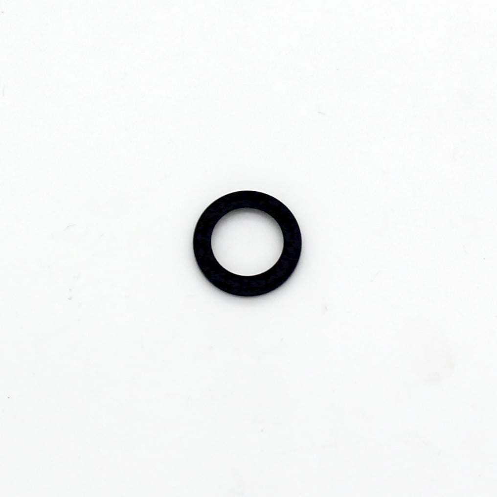 A small black rubber washer or O-ring lies centred on a plain white background.