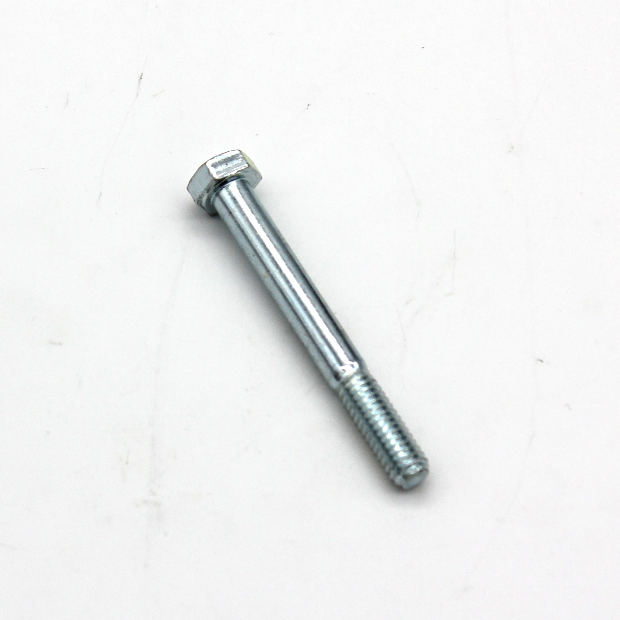 A single metal hex bolt with a partially threaded shank, lying on a plain white surface.