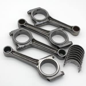 Five metallic connecting rods and eight bearing shells, all engine components, are arranged on a white background. The rods are stacked and angled, whilst the bearing shells are grouped together to the side.