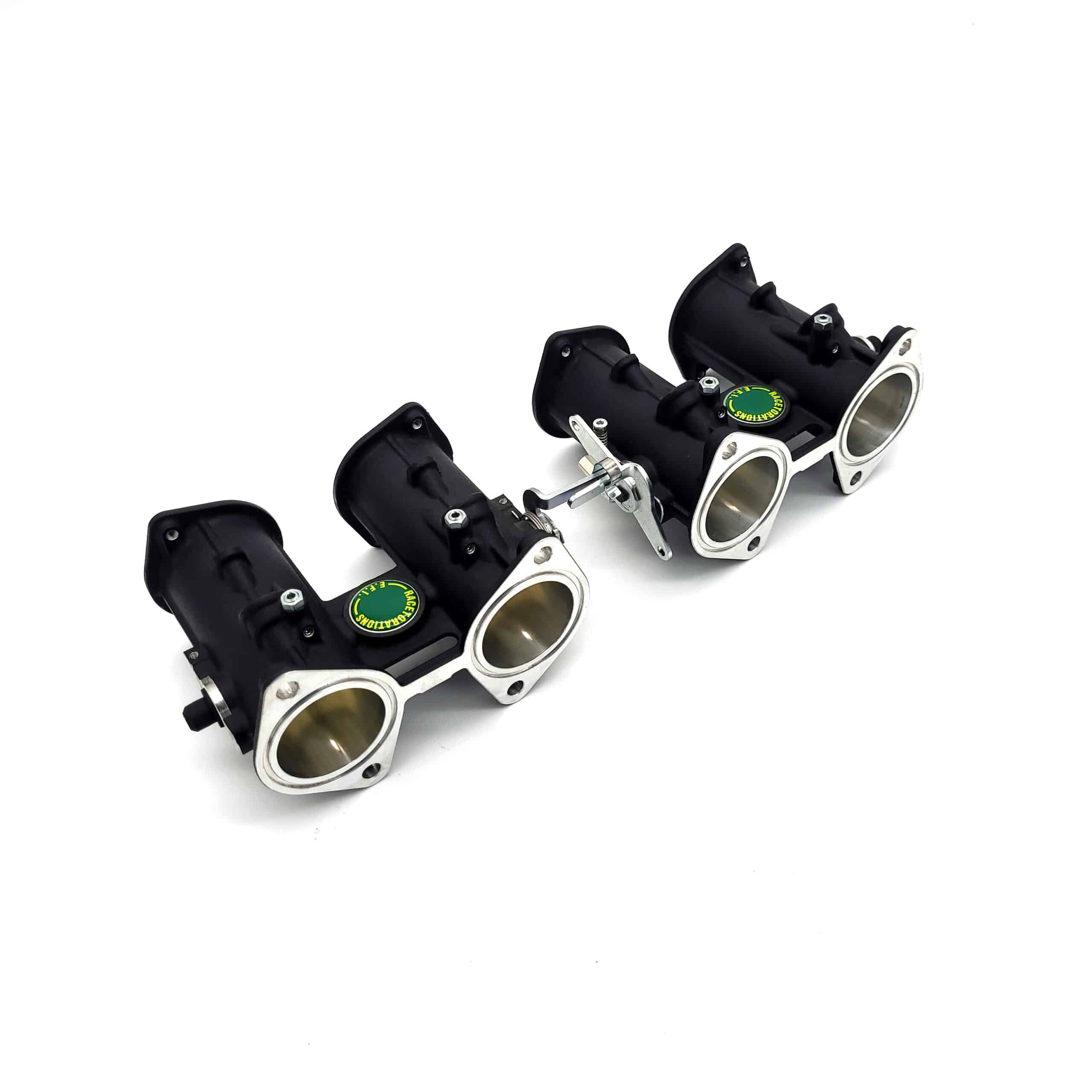 The Jenvey DCOE Throttle Body Set - TR2-4A features two black and silver throttle bodies with circular openings, linked by metal, and is shown against a white background.