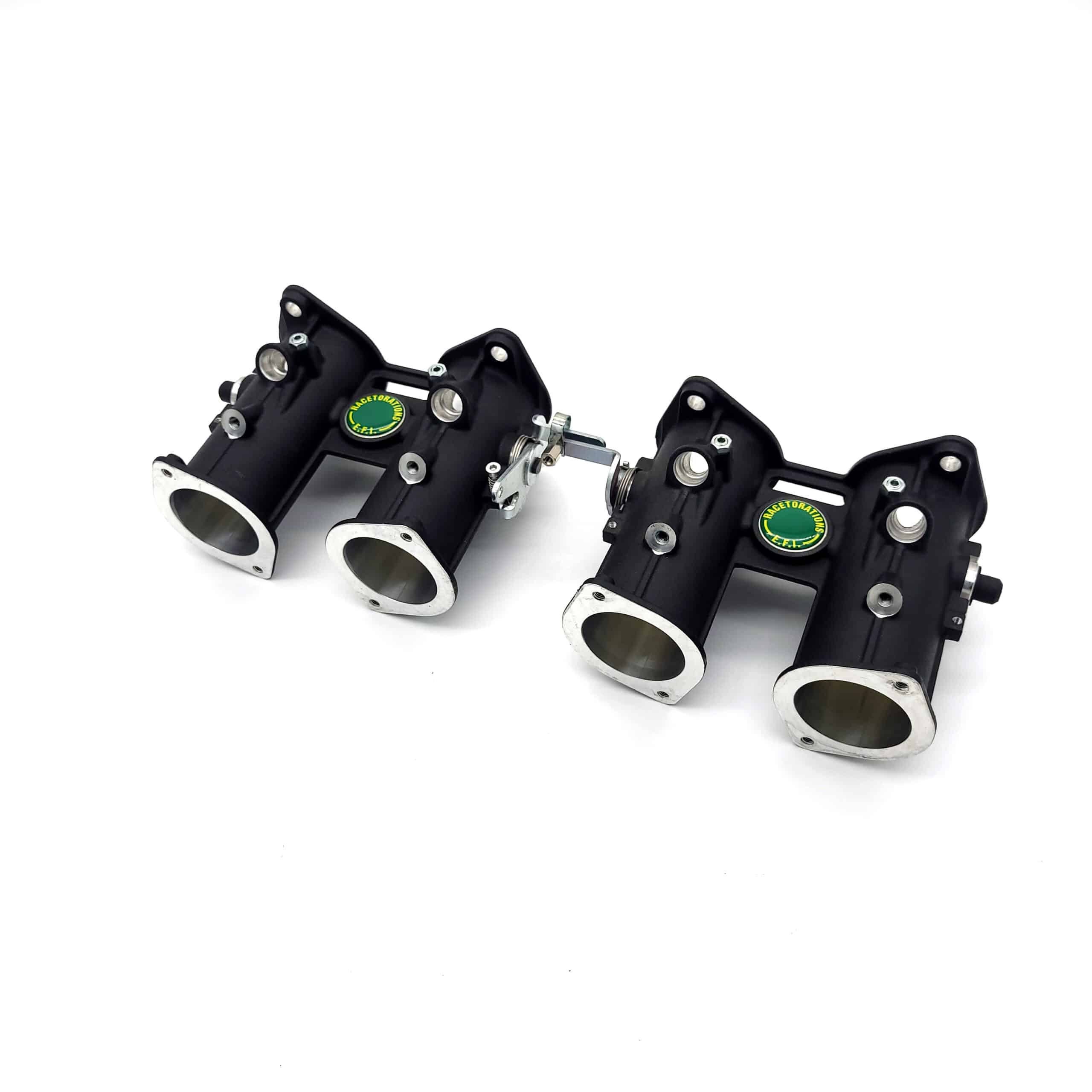 Two black metal Jenvey DCOE Throttle Body Sets for TR2-4A, featuring silver rims and green circular logos, are displayed side by side on a white background.