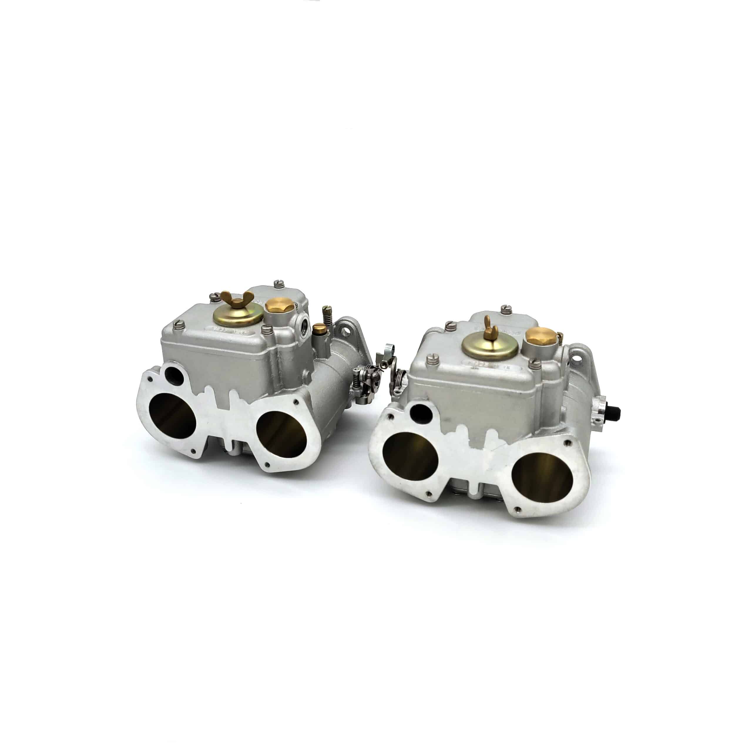 Two metallic Jenvey Heritage Throttle Body Sets for TR2-4A, with silver bodies and gold accents, are positioned side by side on a white background.