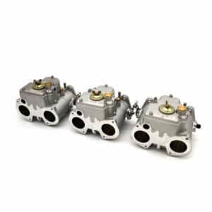 Three Jenvey Heritage Throttle Body Set - TR5-6 units with dual circular inlets are displayed in a row on a white background, highlighting their detailed metallic mechanical components.