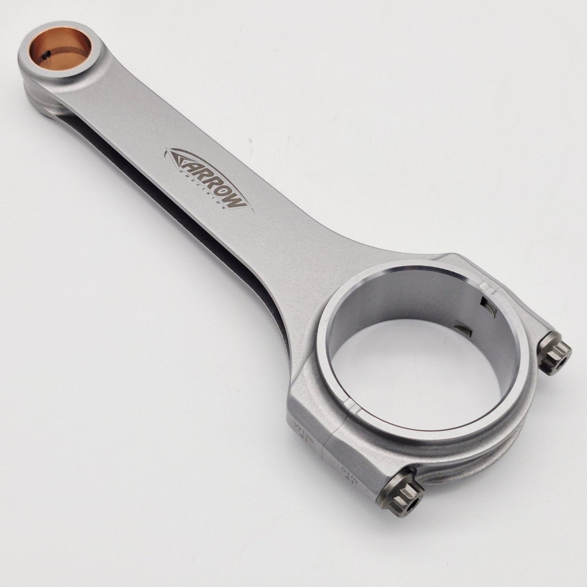 The Racetorations 87mm Slipper Piston & Steel Connecting Rod Set for TR2-4A & Morgan +4 includes a steel rod with bronze-bushed and bolted ends, "ARROW" logo on the shaft, shown on a white background.