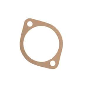 A flat, circular brown gasket with two bolt holes on one side, the Distributor Pedestal Shim Gasket 0.020" is designed for sealing joints in machinery or engines and is commonly used as a distributor pedestal shim in classic Triumph TR5 and TR6 models.