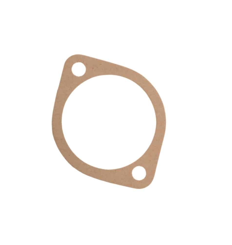 A flat, circular brown gasket with two bolt holes on one side, the Distributor Pedestal Shim Gasket 0.020" is designed for sealing joints in machinery or engines and is commonly used as a distributor pedestal shim in classic Triumph TR5 and TR6 models.
