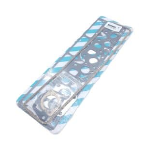 A packaged Payen Triumph TR5, TR250, and TR6 Head Gasket Set for Flat Top Block, containing multiple gaskets of different shapes and sizes, wrapped in clear plastic and displayed on a blue and white striped backing.