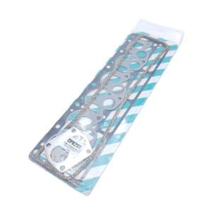 The Payen Triumph TR6 Head Gasket Set for Recessed Top Block comes packaged with multiple gaskets—including a large metal head gasket designed for recessed top blocks, as well as thinner cork and fibre gaskets—all neatly arranged on blue-and-white striped backing.