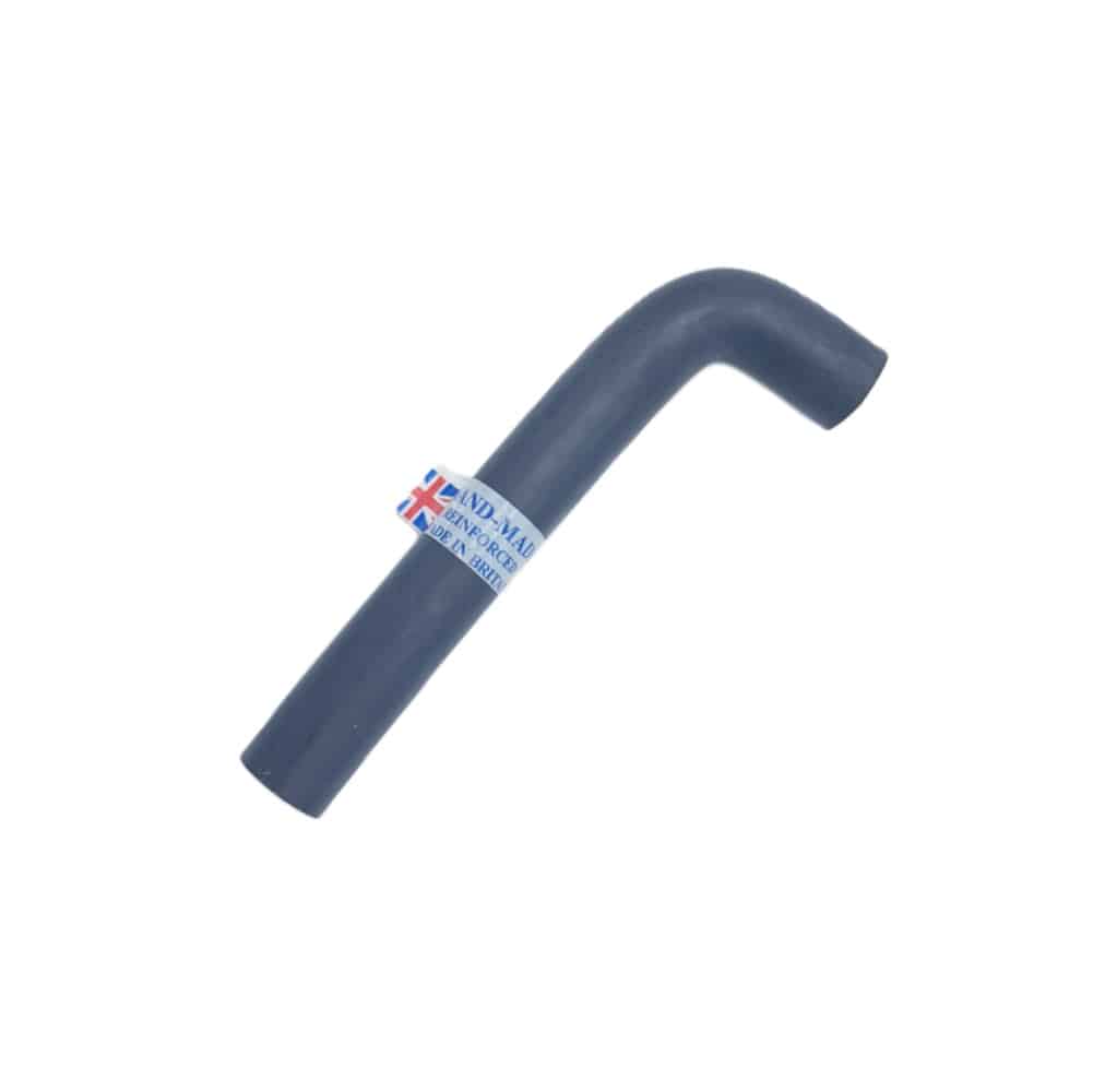 A black, L-shaped Engine to Bulkhead Hose for Triumph TR2 to TR3B, made of rubber and featuring a sticker with a small Union Jack flag and text, is shown against a plain white background.