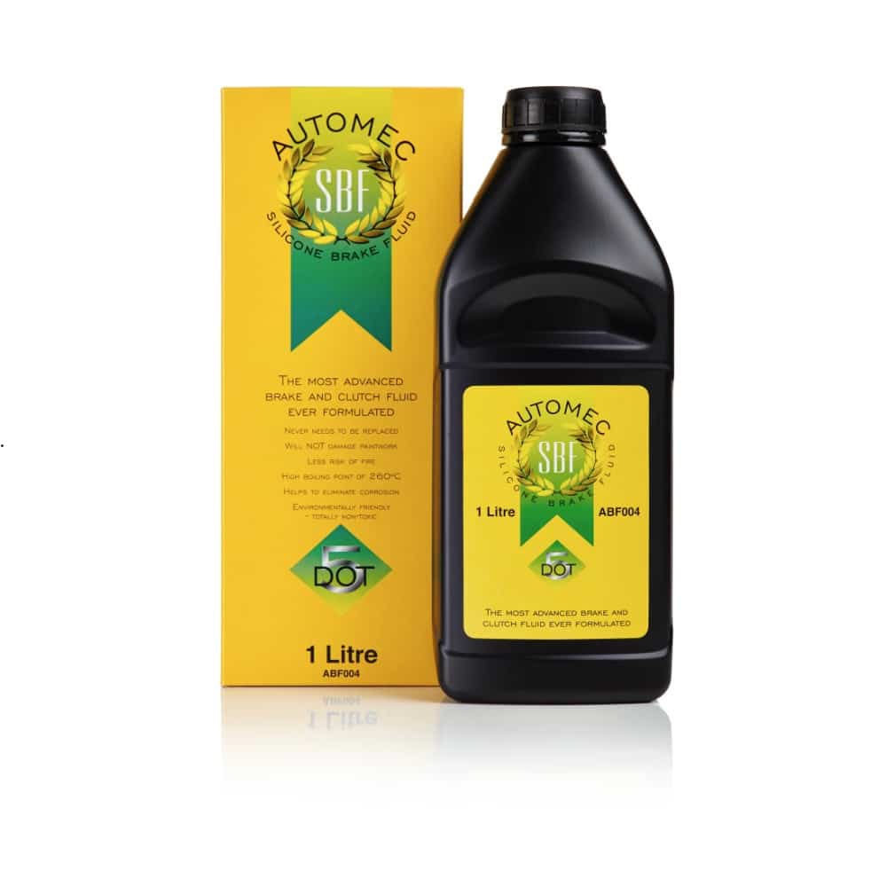 A yellow product box and a black plastic bottle of Silicon Brake & Clutch Fluid Dot 5 - 500 ml (Copy), both featuring a logo with a wreath and the text “SBF DOT 5.”